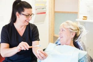 hygienist demonstrating brushing